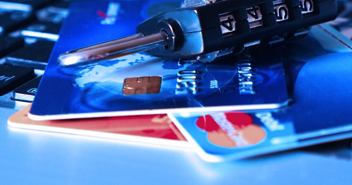 Lock sitting on credit cards illustrating security