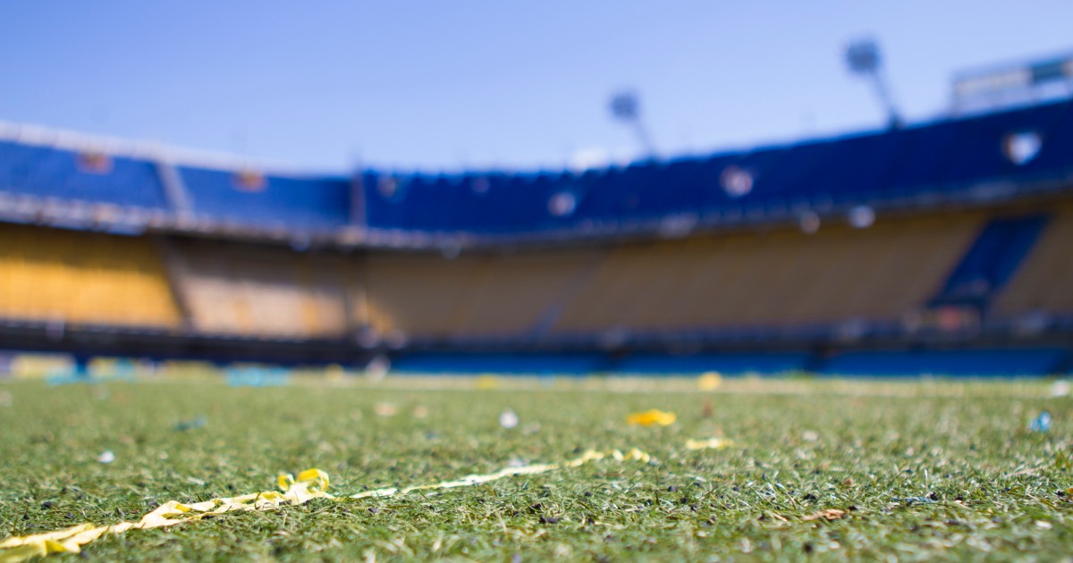 Large stadium with blurred seats in background