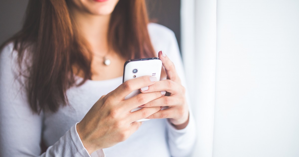 Lady looking at something on her phone