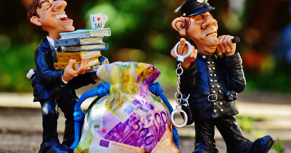 Colorful clay figures of a police man and business man with a bag of money