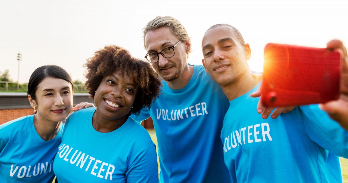 Four volunteers taking a selfie